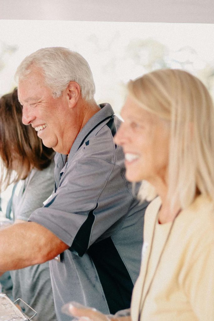 people smiling at a gathering