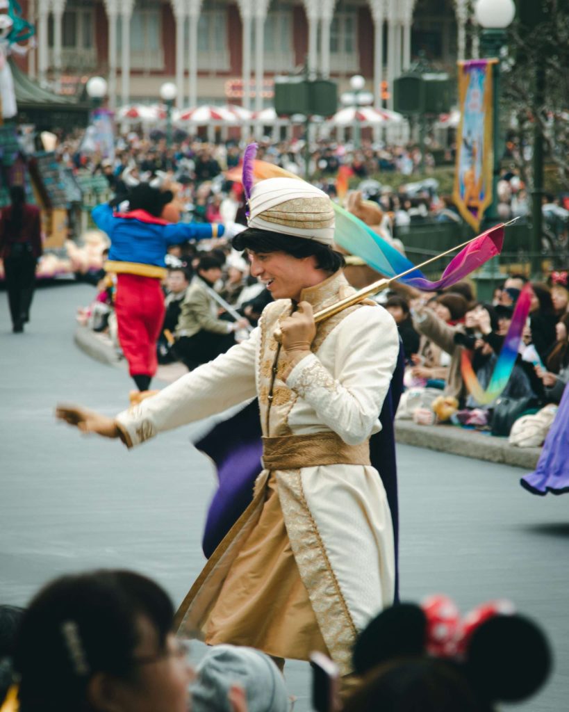 a Disney performer waving