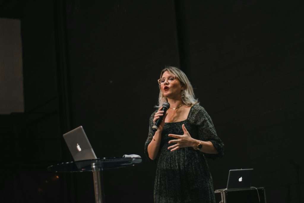 A speaker using a microphone